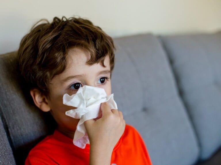 a young boy suffers from airborne allergens in the home
