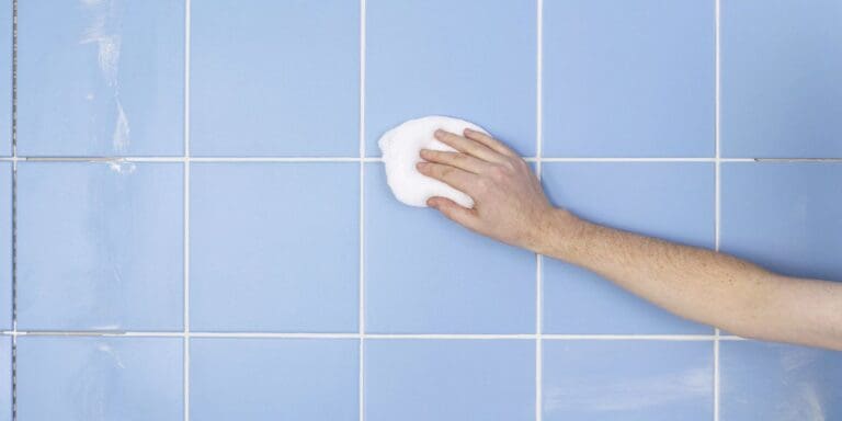 a person cleaning grout banner image