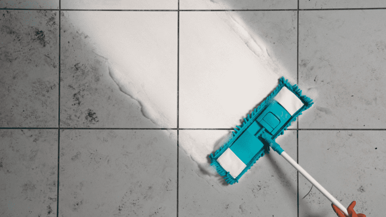 close shot of a mop, cleaning ceramic tile floor