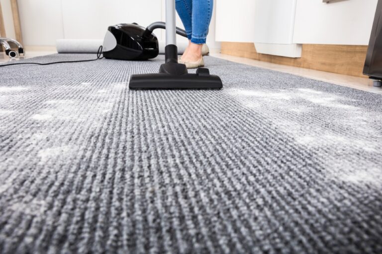 close shot of a vacuum cleaner on carpet.